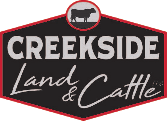 Logo of Creekside Land & Cattle, featuring a black and red design with the text "Creekside Land & Cattle LLC" and an illustration of a cow at the top.